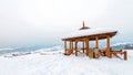 observation point in the mountains Poland - a traditional wooden gazebo covered with snow in winter