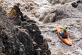 Observation of a sportsman on a kayak passing rapids along the river. boat on a mountain