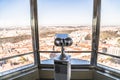 Observation telescope in Prague against window with panorama