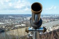 observation telescope for tourists at drachenfels platform, blurred landscape as backgroound