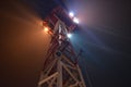 Observation tower by night with searchlights and cameras