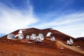 Observatories on top of Mauna Kea mountain peak. Astronomical research facilities and large telescope observatories located at the Royalty Free Stock Photo