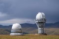 Observatory telescope on green valley among mountains mountains in day, great design for any purposes.