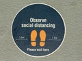 Observe social distancing sign on city street