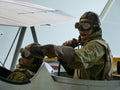 Observer points out an enemy plane to the pilot in a wax hystorical reconstruction.