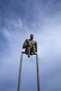 Observer - small bronze street sculpture on Santorini island, Greece