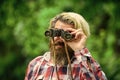 Observing nature. Man ornithology expedition in forest. Man observing nature. Hipster tourist holds binoculars nature Royalty Free Stock Photo