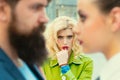 Obsessed ex girlfriend spying to a couple dating. She is obviously jealous. Bearded man cheating his girlfriend with Royalty Free Stock Photo