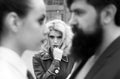 Obsessed ex girlfriend spying to a couple dating. She is obviously jealous. Bearded man cheating his girlfriend with Royalty Free Stock Photo