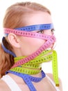 Obsessed fitness woman with colorful measure tapes