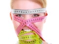 Obsessed fitness woman with a lot of colorful measure tapes