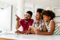 Obsessed to tech devices happy african american family using digital tablet, computer, smartphones