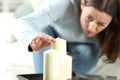 Obsessed woman aligning candles accurately Royalty Free Stock Photo