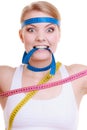 Obsessed woman with measure tapes. Diet.