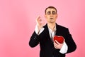 Obsession and romance. Theatre actor pantomime falling in love. Mime man hold red heart for valentines day. Mime actor