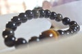 obsidian and tiger eye stone bracelet On selenite stone . Royalty Free Stock Photo