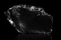 Obsidian, volcanic glass, black background, natural rock