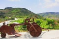 Obsolete agricultural tillage farm equipment near vineyard. Rusty vintage plow