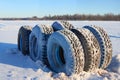 obsolete car wheels on the background of a winter snow-covered forest, beautiful landscape, a concept of traffic safety on a