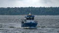 Obsolete local public transport waterbus sailing along coastline of islands in Gulf of Finland near to Vyborg