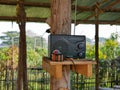 An obsolete radio receiver being used at home in a rural area of Thailand