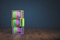 Obsolete rainbow TV pile
