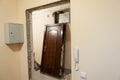 Obsolete steel door is deinstalled from doorframe, flat renovations Royalty Free Stock Photo