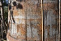 Obsolete wooden barrel with rust pattern, soft focus texture