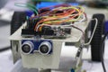 Obstacle avoiding robot made using programmable micro controller and ultrasonic sensor along with dc motors and wheels as a STEM
