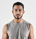 Obstacles will disappear when you walk boldly through them. Studio portrait of a sporty young man posing against a white