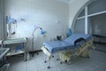 Obstetric bed at the delivery room of the maternity hospital, medical equipment set