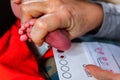 Obstetrician checks newborn infant Royalty Free Stock Photo