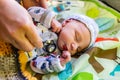 Obstetrician checks newborn infant