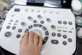 Obstetrician Pushes Buttons on a Control Panel Before Starting Ultrasound Sonogram Procedure