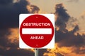 Obstruction sign with stormy clouds