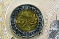 Egyptian 1 LE EGP One Egyptian pound coin on Egyptian banknote, Translation of Arabic (Police day 69 years) in the