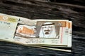 Obverse side o 10 Saudi riyals cash on a wooden background Royalty Free Stock Photo