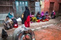 Ocal people sit in the street. The caste system is still intact today but the rules are not as rigid as they were in the past.