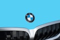 OCALA, FLORIDA - 2 NOVEMBER 2023 BMW logo emblem on aqua car hood front. Bavaria motor works is a German multinational