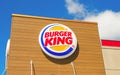 OCALA, FLORIDA USA - OCTOBER 14, 2023 Burger King logo blue sky background with white clouds. Second most famous fast food chain