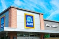 OCALA, FLORIDA USA - OCTOBER 22, 2023 frontage and brand logo of a branch of German discount retail outlet grocery store Aldi,