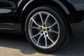 OCALA, FLORIDA USA - OCTOBER 22, 2023 Porsche emblem on clean shiny polished wheel on black automobile. Horse with antlers
