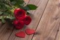 Occasional beautiful red roses with decorative hearts and a place for dedications or wishes