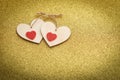 Occasional decorative hearts on a shiny gold background with a place for an inscription Royalty Free Stock Photo
