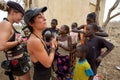 Occidental women interacting with African children in Mali