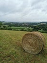 occitanie straw bale in a field and in the distance Montolieu village du livre