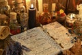 Magic book with spells, lavender bunch and black candle on witch table Royalty Free Stock Photo