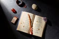 Magic book, wax candle, matches and gem stones