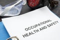Occupational health and safety ohs act with the blue folder