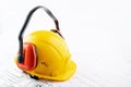 Occupational safety in construction, health protection at work, protective clothing, worker`s uniform, engineer`s helmet, ear